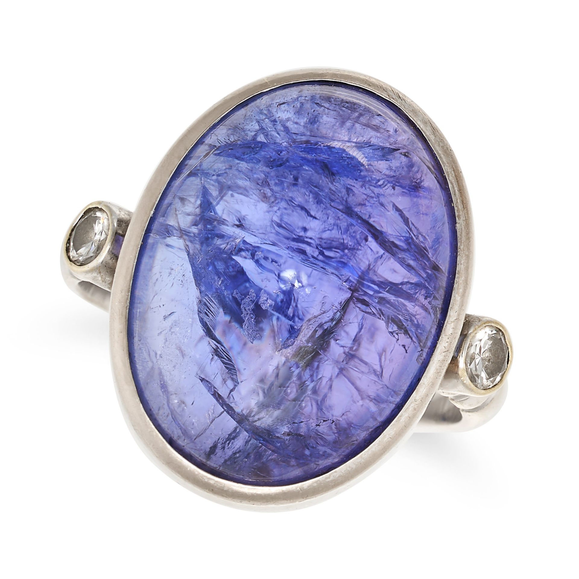 A TANZANITE AND DIAMOND RING in 18ct white gold, set with a cabochon tanzanite of approximately 1...