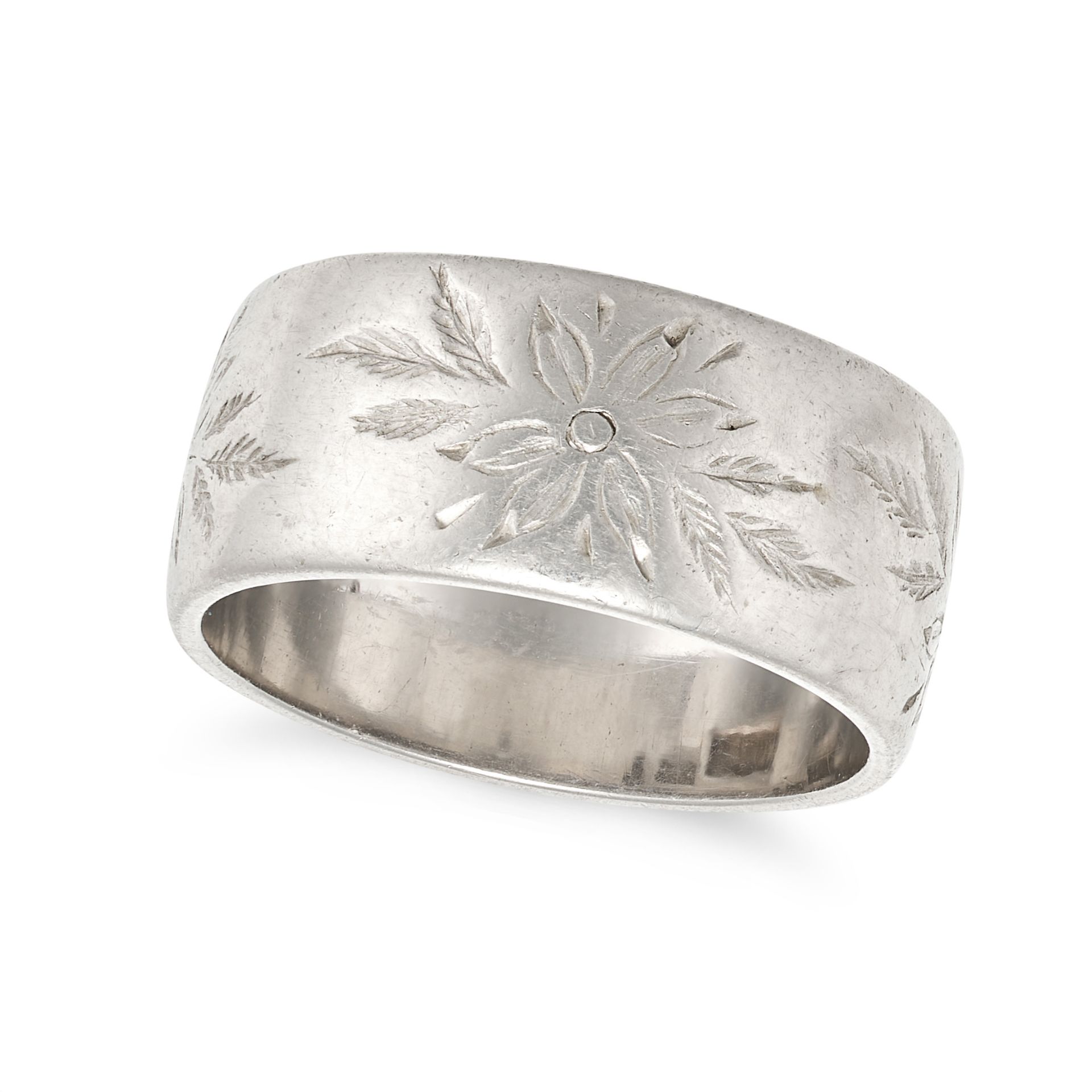 A PLATINUM BAND RING the wide band engraved with foliate motifs, CC&S maker's marks, stamped plat...