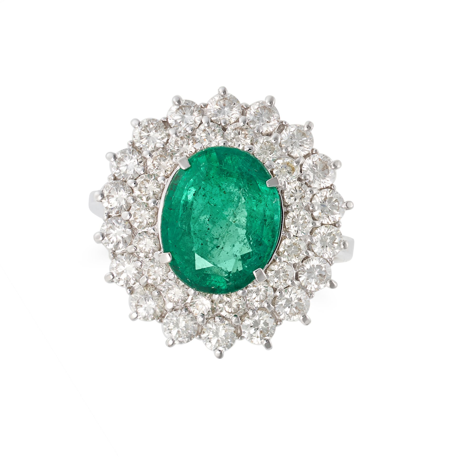 AN EMERALD AND DIAMOND CLUSTER RING in 18ct white gold, set with an oval cut emerald of 2.49 cara...