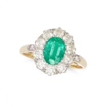 AN EMERALD AND DIAMOND CLUSTER RING in 18ct yellow gold, set with an oval cut emerald of approxim...