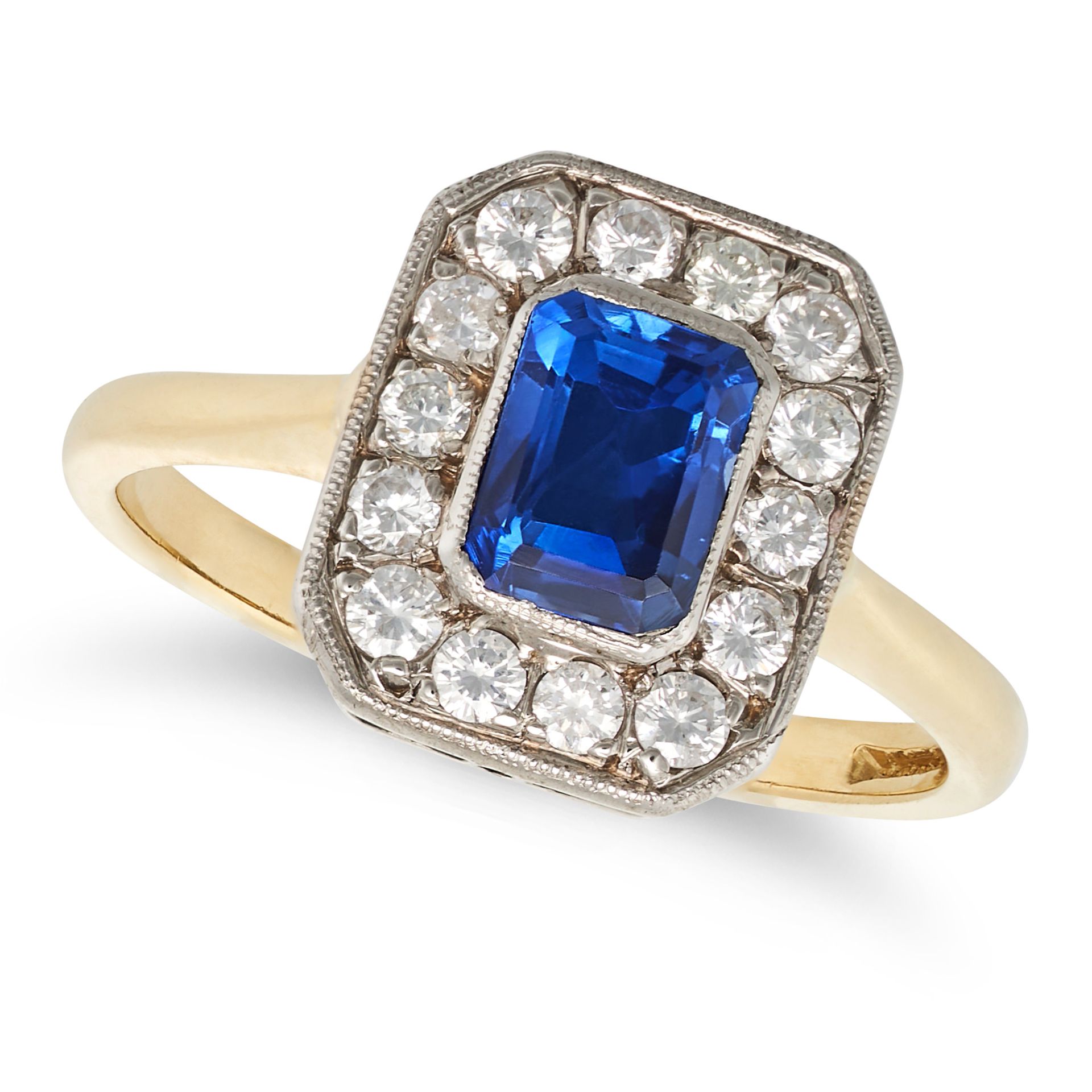 A SAPPHIRE AND DIAMOND RING in 18ct yellow gold, set with an octagonal step cut sapphire of appro...