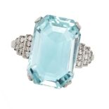 AN AQUAMARINE AND DIAMOND RING set with an octagonal step cut aquamarine of 9.27 carats, the step...