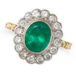 AN EMERALD AND DIAMOND CLUSTER RING in 18ct yellow gold, set with an oval cut emerald of approxim...