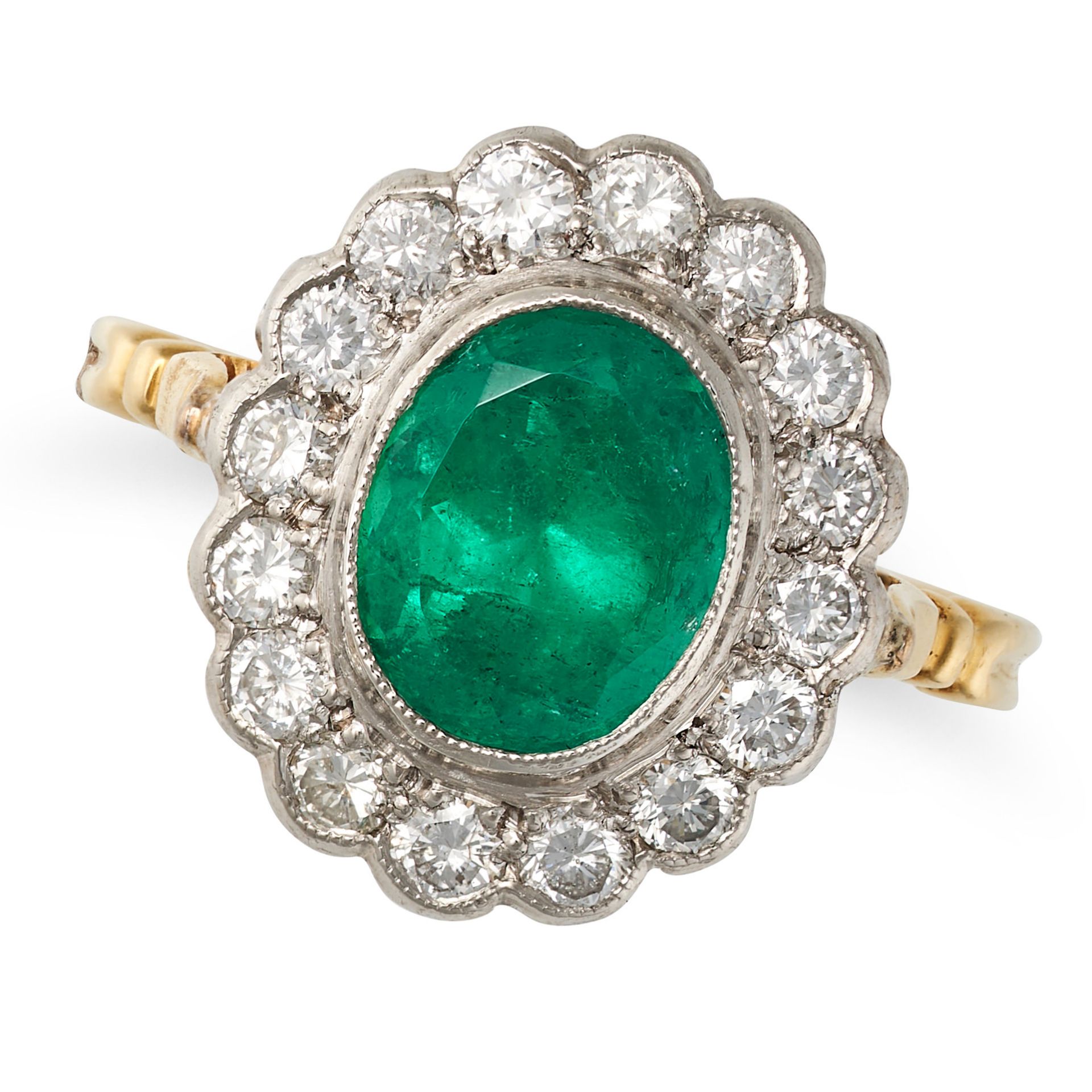 AN EMERALD AND DIAMOND CLUSTER RING in 18ct yellow gold, set with an oval cut emerald of approxim...