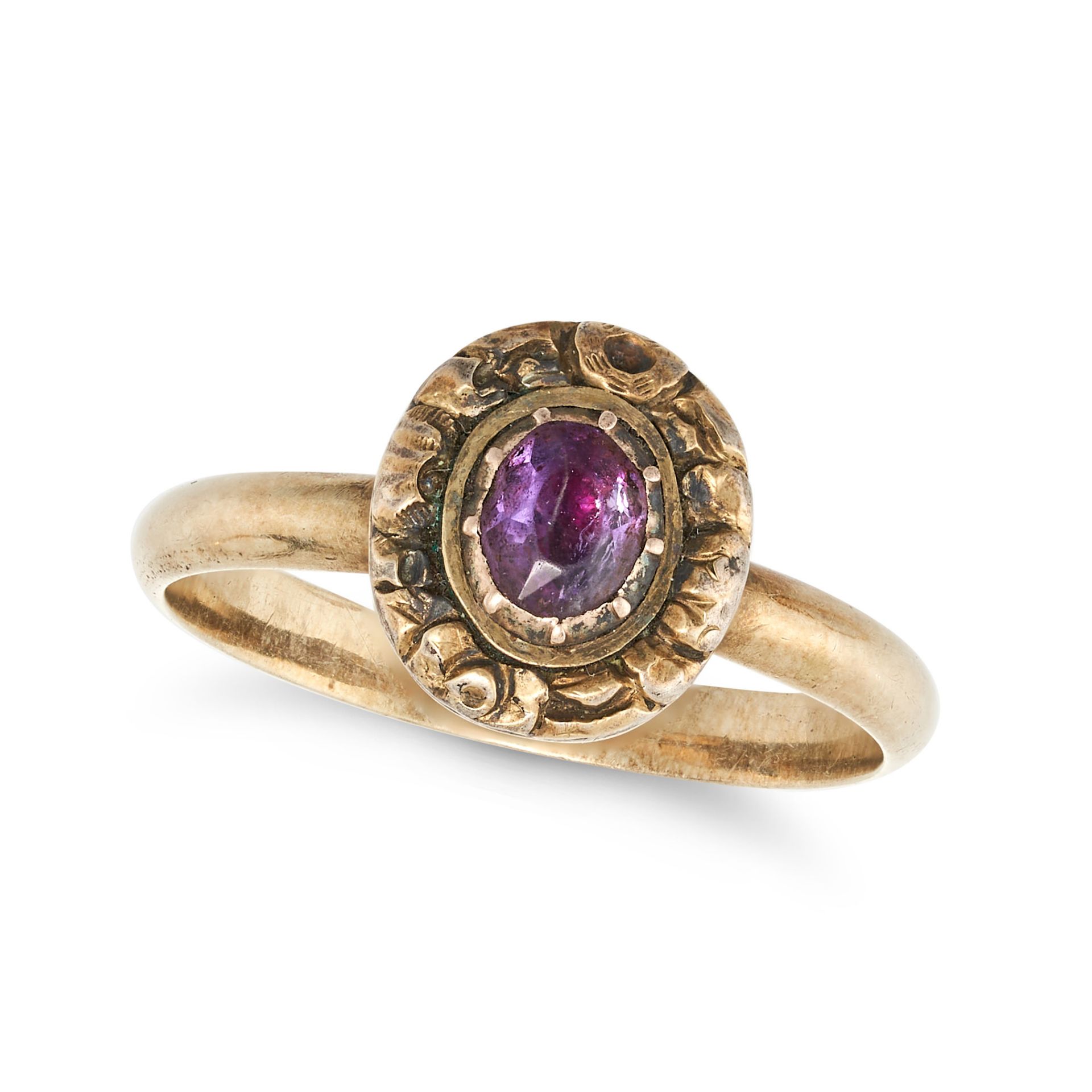 AN ANTIQUE AMETHYST RING set with an oval cut amethyst in an engraved surround, no assay marks, s...