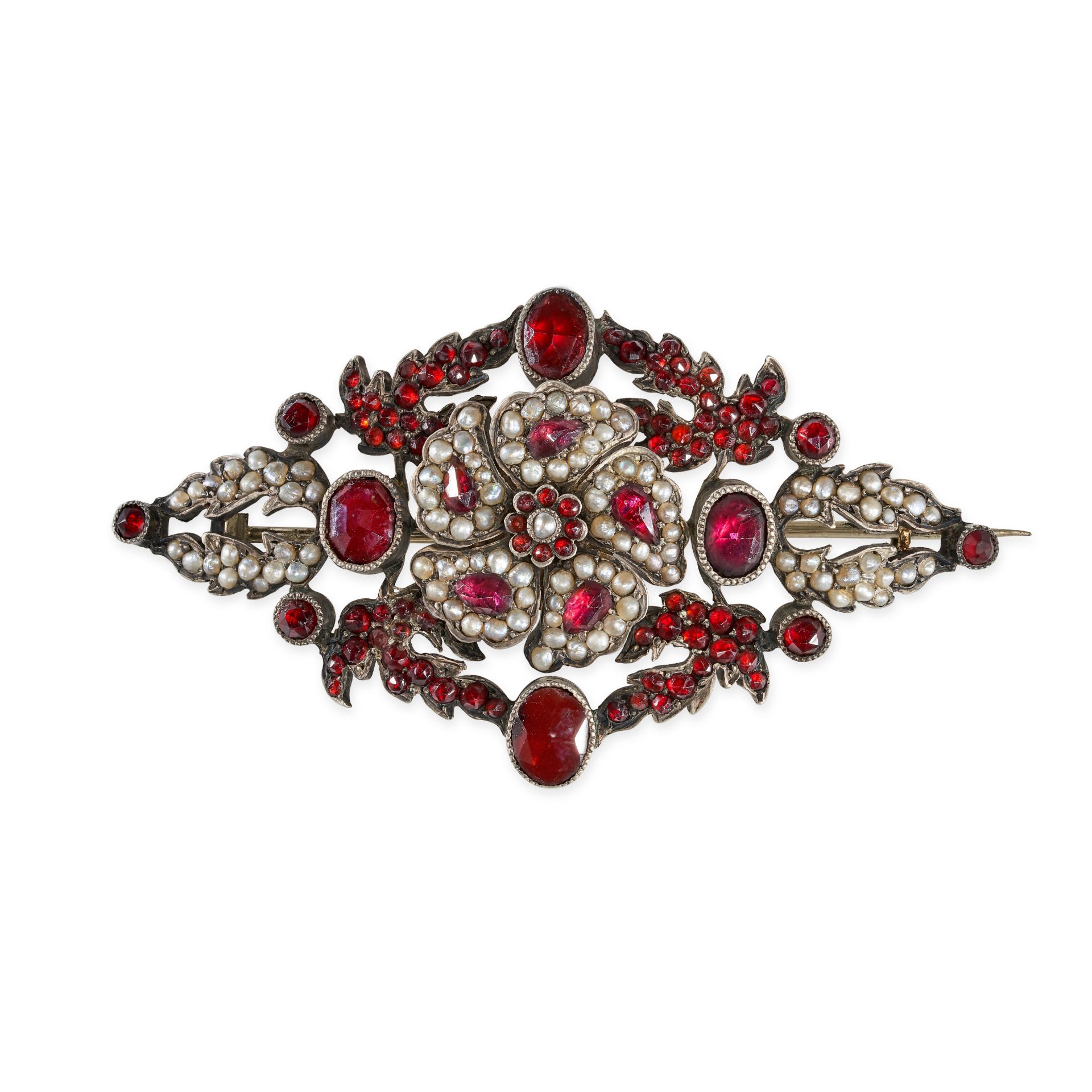 AN ANTIQUE PEARL AND GARNET BROOCH in silver, set to the centre with a cluster of garnets and pea...