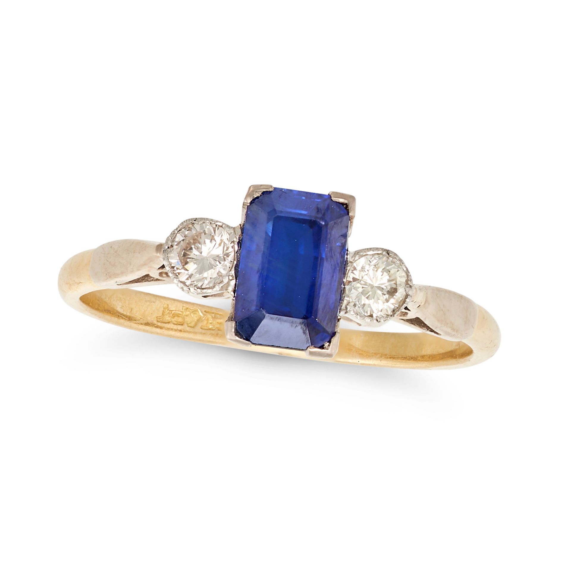 A SAPPHIRE AND DIAMOND THREE STONE RING in 18ct yellow gold and platinum, set with a rectangular ...