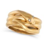AN ANTIQUE DIAMOND SNAKE RING in yellow gold, designed as a coiled snake, the eyes set with rose ...