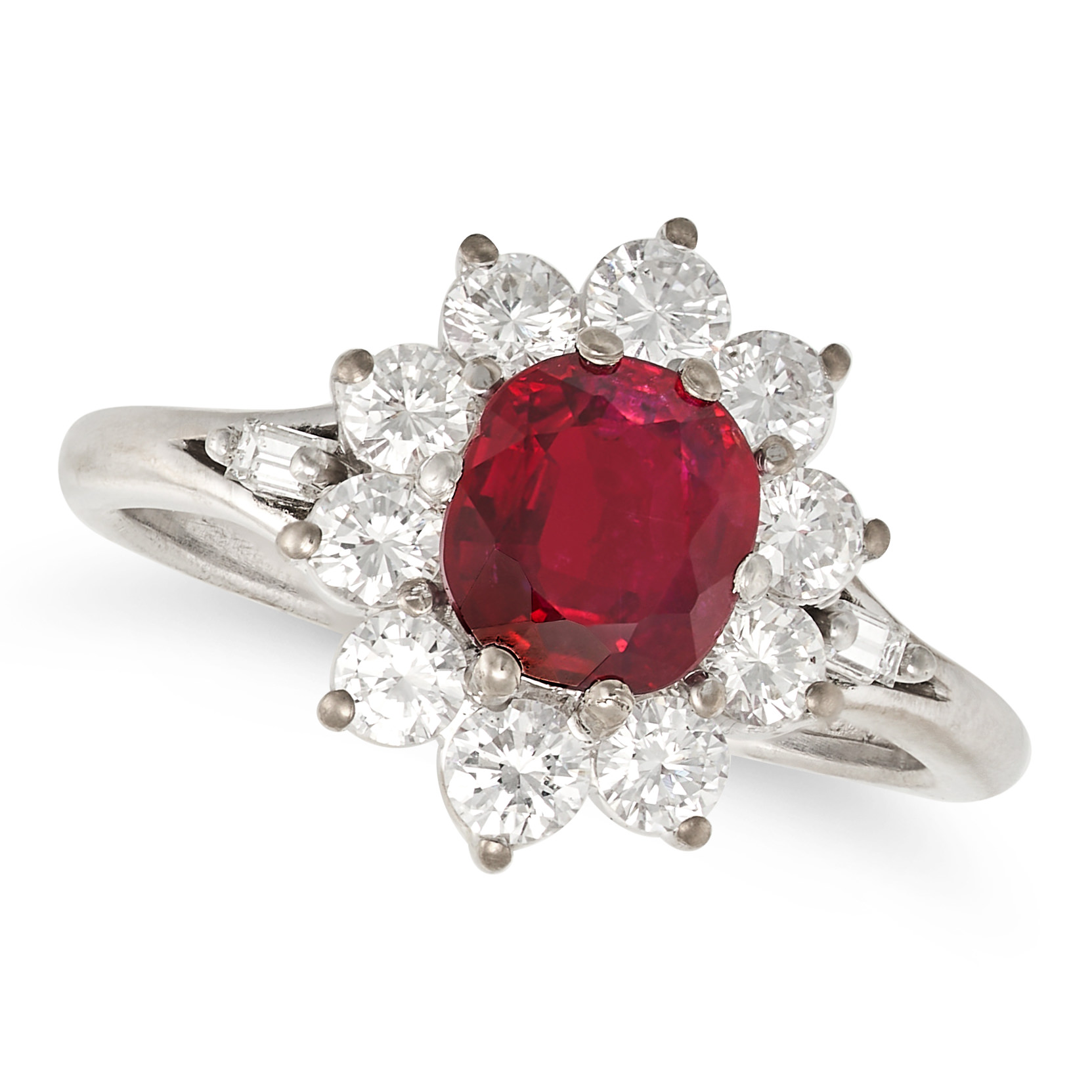 A RUBY AND DIAMOND CLUSTER RING in 18ct white gold and platinum, set with an oval cut ruby of app...