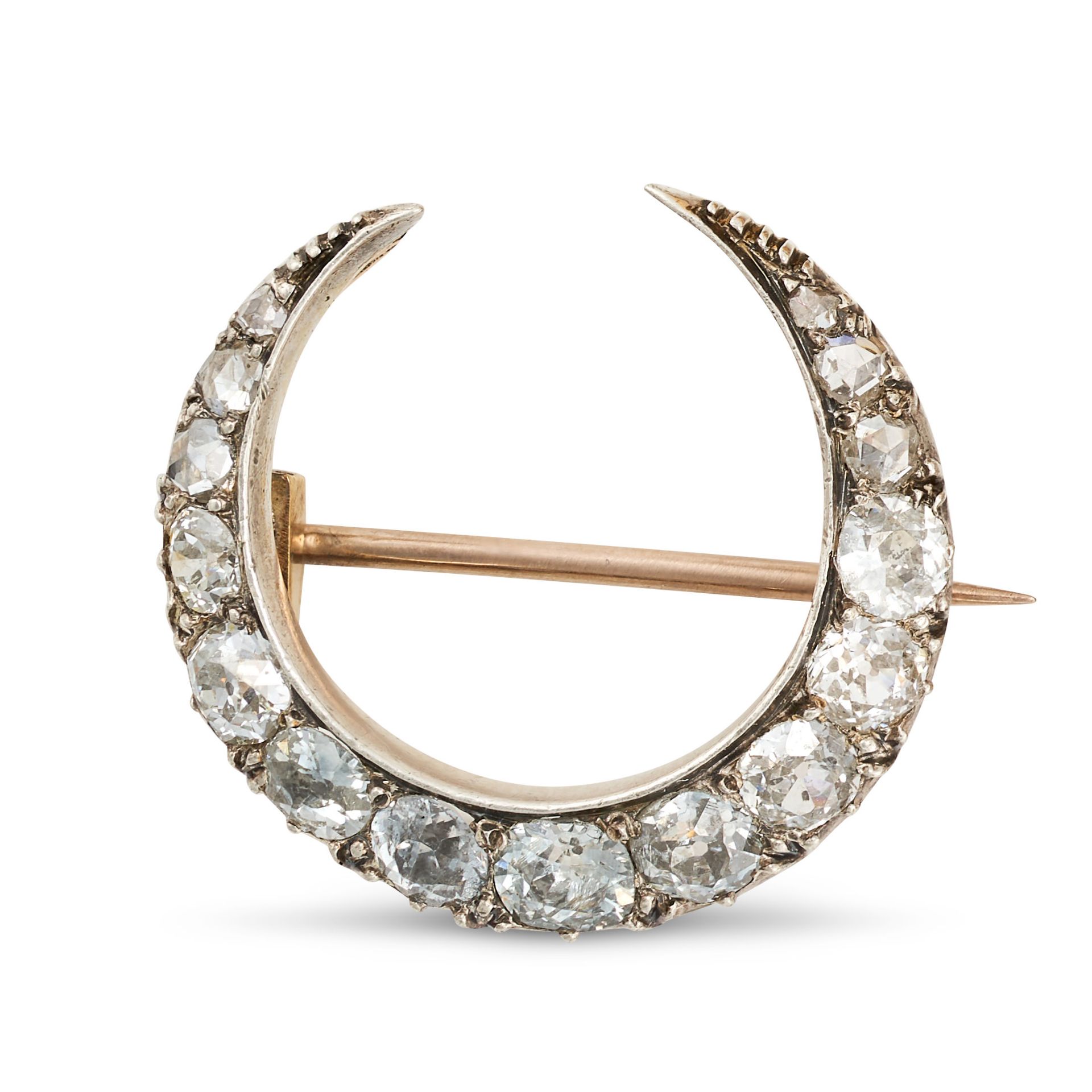 AN ANTIQUE DIAMOND CRESCENT MOON BROOCH in yellow gold and silver, set with graduating old mine a...