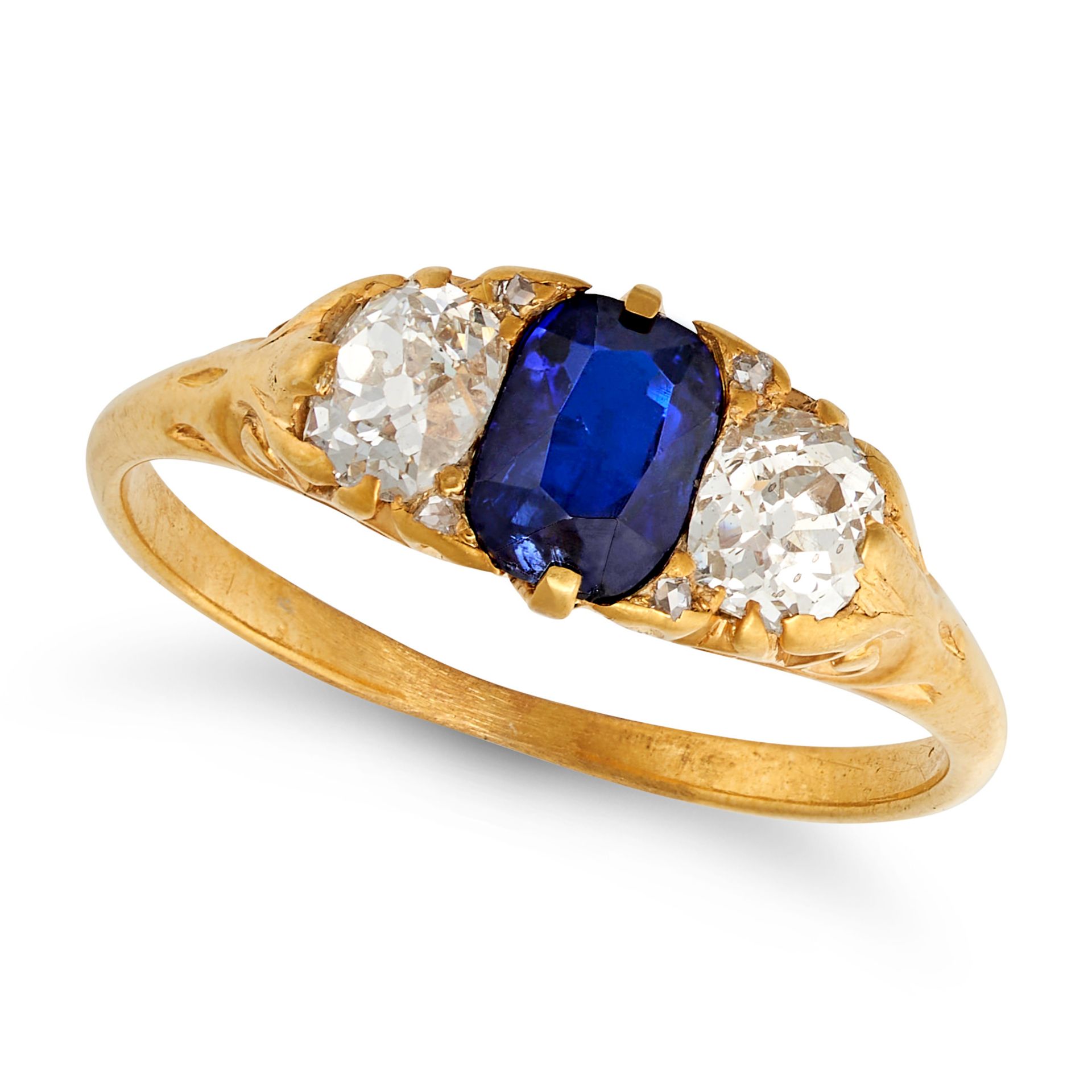 AN ANTIQUE SAPPHIRE AND DIAMOND RING in yellow gold, set with a cushion cut sapphire of approxima...