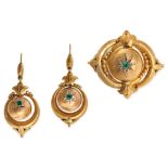 AN ANTIQUE EMERALD ETRUSCAN REVIVAL SUITE in yellow gold, comprising a pair of earrings and a bro...