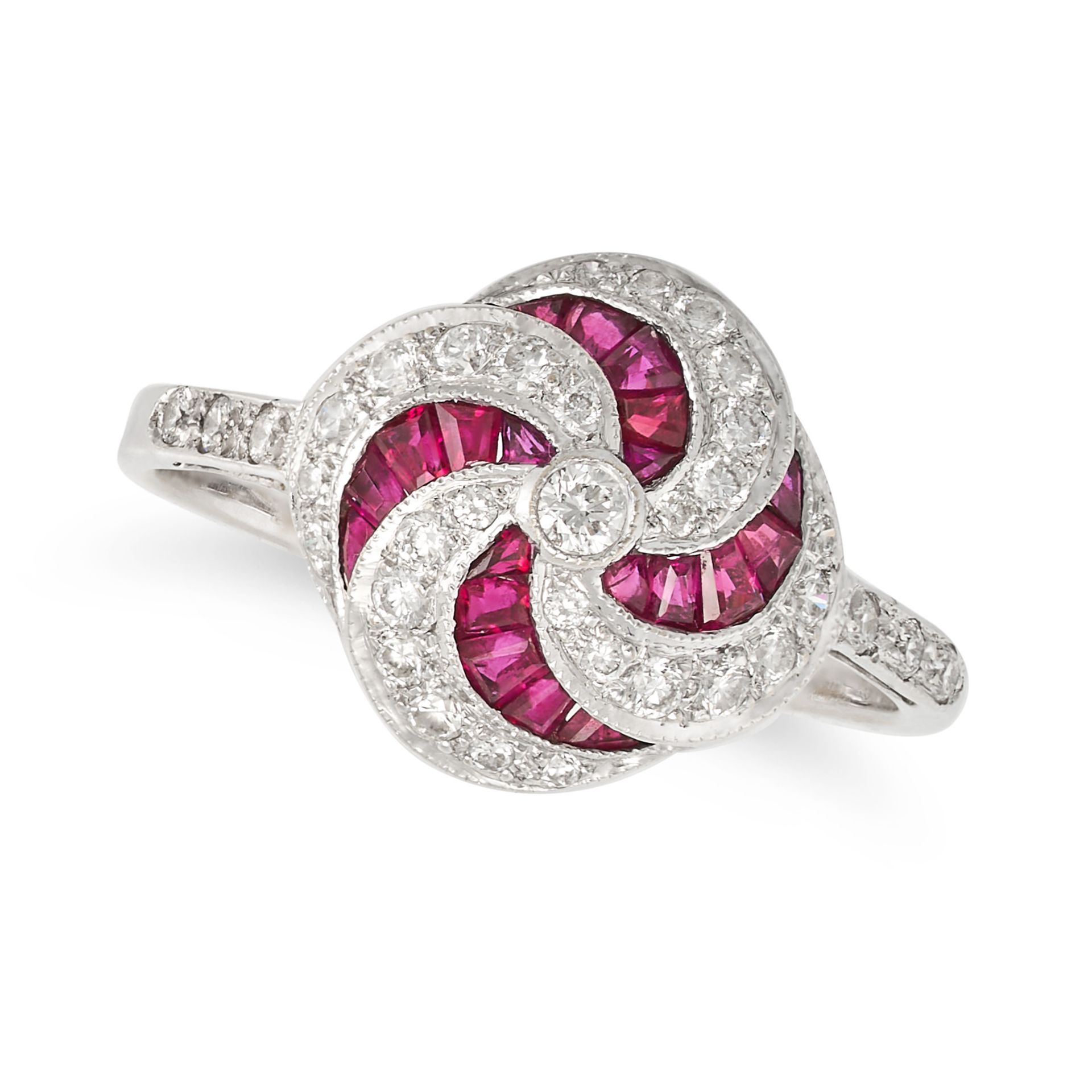 A RUBY AND DIAMOND DRESS RING in 18ct white gold, set with calibre cut rubies and round brilliant...