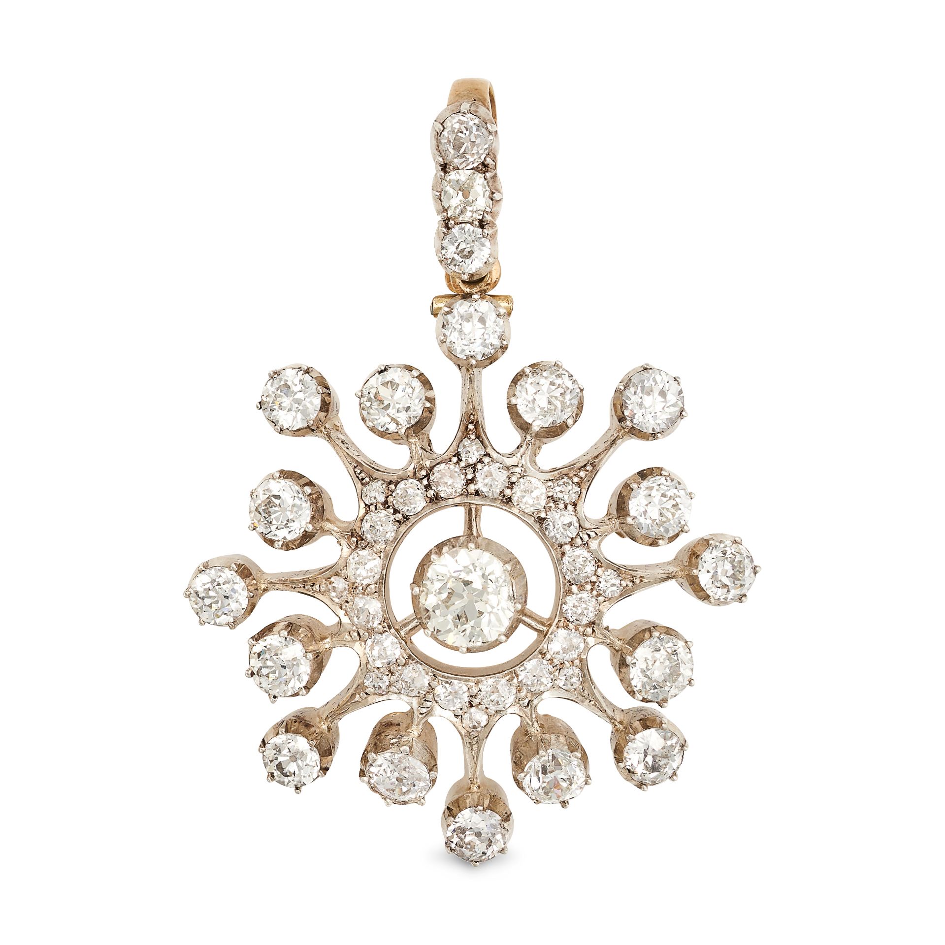 AN ANTIQUE DIAMOND STAR PENDANT in yellow gold and silver, in a stylised star design, set through...