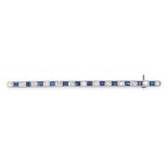 A VINTAGE SAPPHIRE AND DIAMOND BAR BROOCH in platinum and 18ct white gold, set with a row of alte...