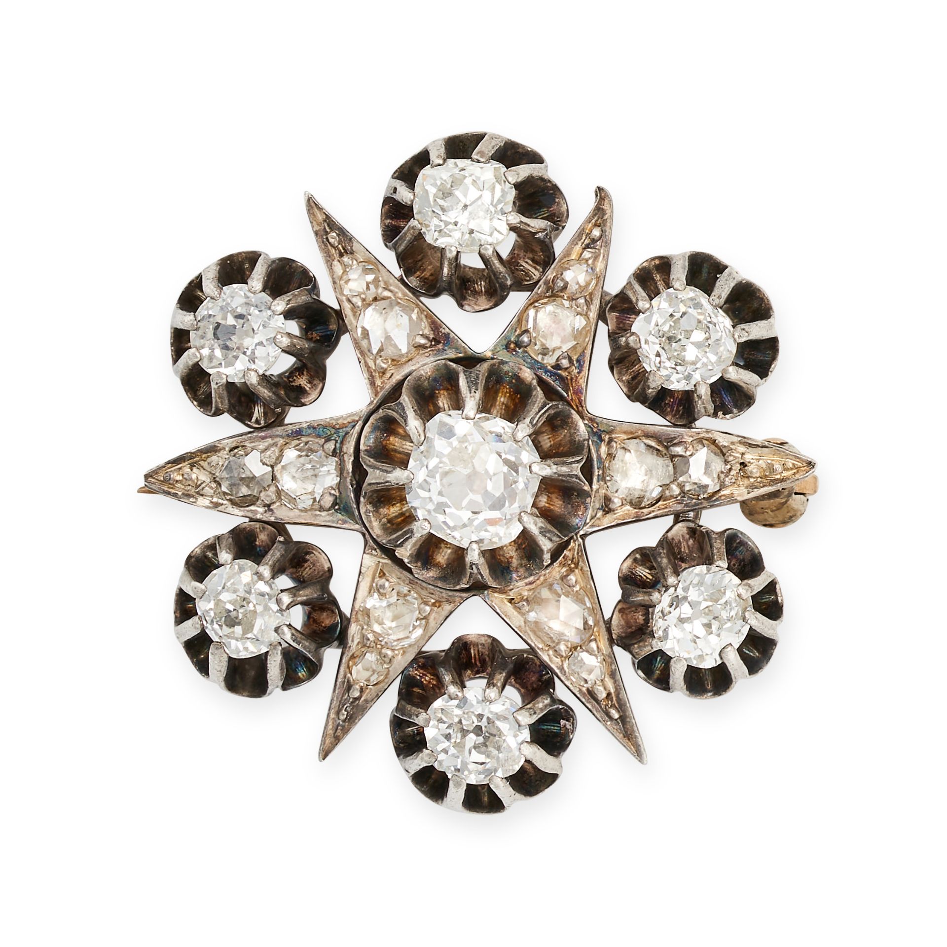 AN ANTIQUE DIAMOND STAR BROOCH in yellow gold and silver, designed as a six rayed star set throug...