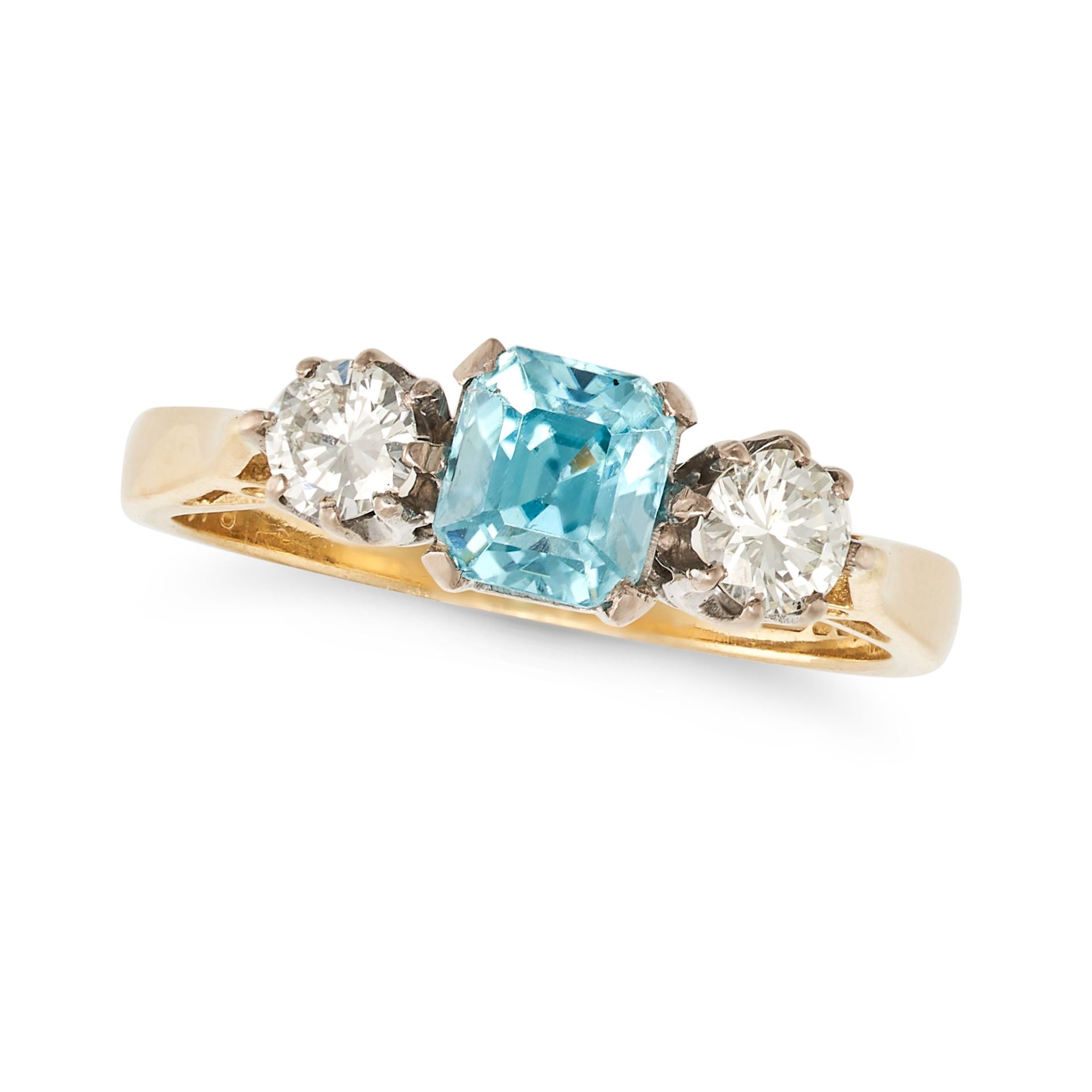 A BLUE ZIRCON AND DIAMOND THREE STONE RING in 18ct yellow gold, set with an octagonal mixed cut b...