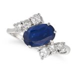 A SAPPHIRE AND DIAMOND RING set with an oval cut sapphire accented by round brilliant cut diamond...