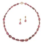 A PINK TOURMALINE BEAD NECKLACE AND EARRINGS SUITE the necklace set with a row of graduated polis...
