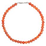 NO RESERVE - A CARNELIAN BEAD NECKLACE comprising a row of polished carnelian beads, no assay mar...