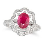 A RUBY AND DIAMOND DRESS RING in 18ct white gold, set with an oval cut ruby in a stylised border ...