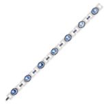 A RAINBOW MOONSTONE, SAPPHIRE AND DIAMOND BRACELET in 18ct white gold, comprising seven plaques s...