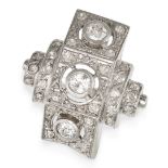 A DIAMOND DRESS RING the geometric face set with a trio of old cut diamonds, accented throughout ...