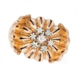 A VINTAGE DIAMOND RING in 18ct yellow gold, the domed face set with a cluster of round cut diamon...