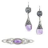 NO RESERVE - AN AMETHYST BROOCH AND PAIR OF DROP EARRINGS the silver brooch in Celtic design, set...