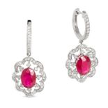 A PAIR OF RUBY AND DIAMOND DROP EARRINGS in 18ct white gold, comprising a hoop set with a row of ...
