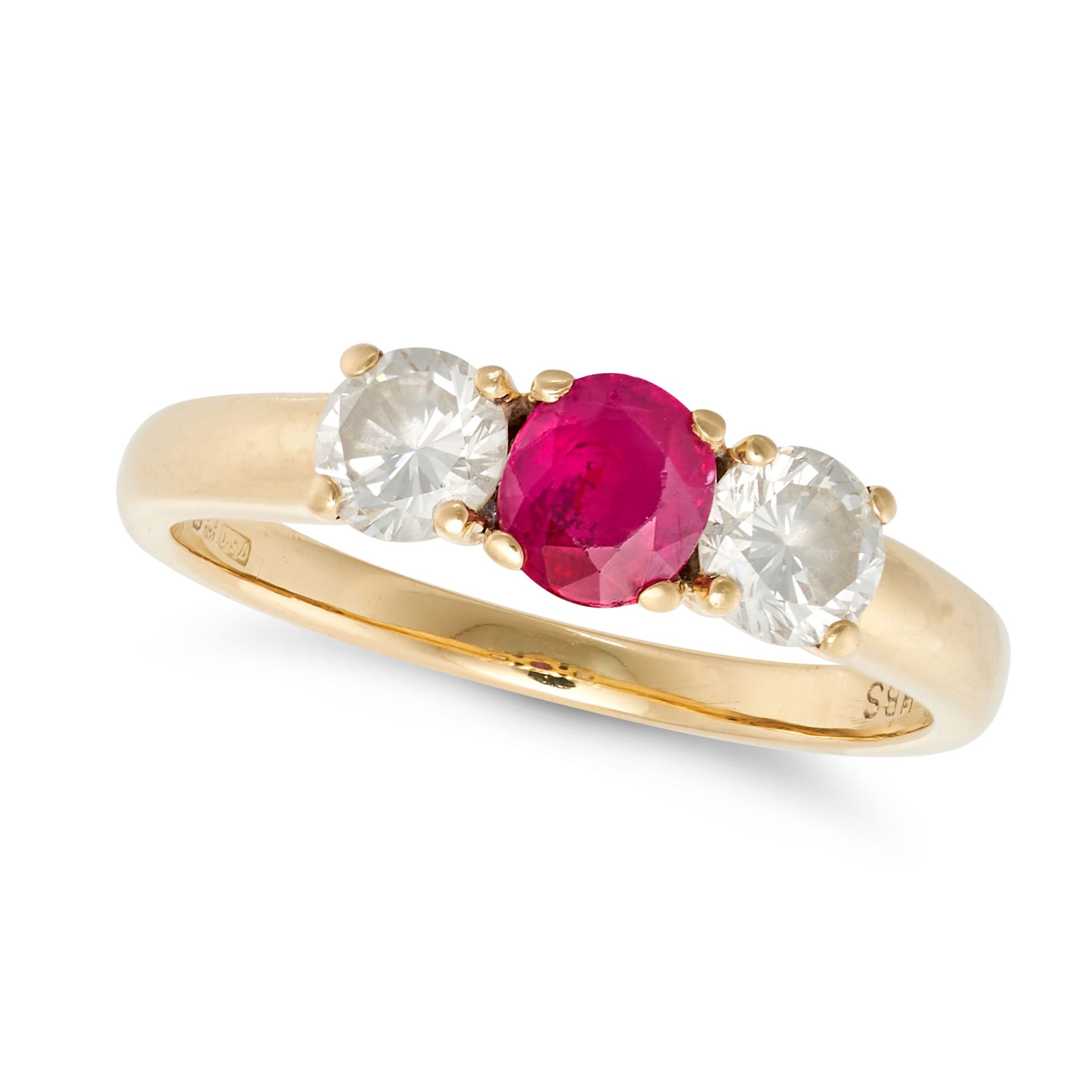 A RUBY AND DIAMOND THREE STONE RING in 18ct yellow gold, set with an oval cut ruby accented on ea...