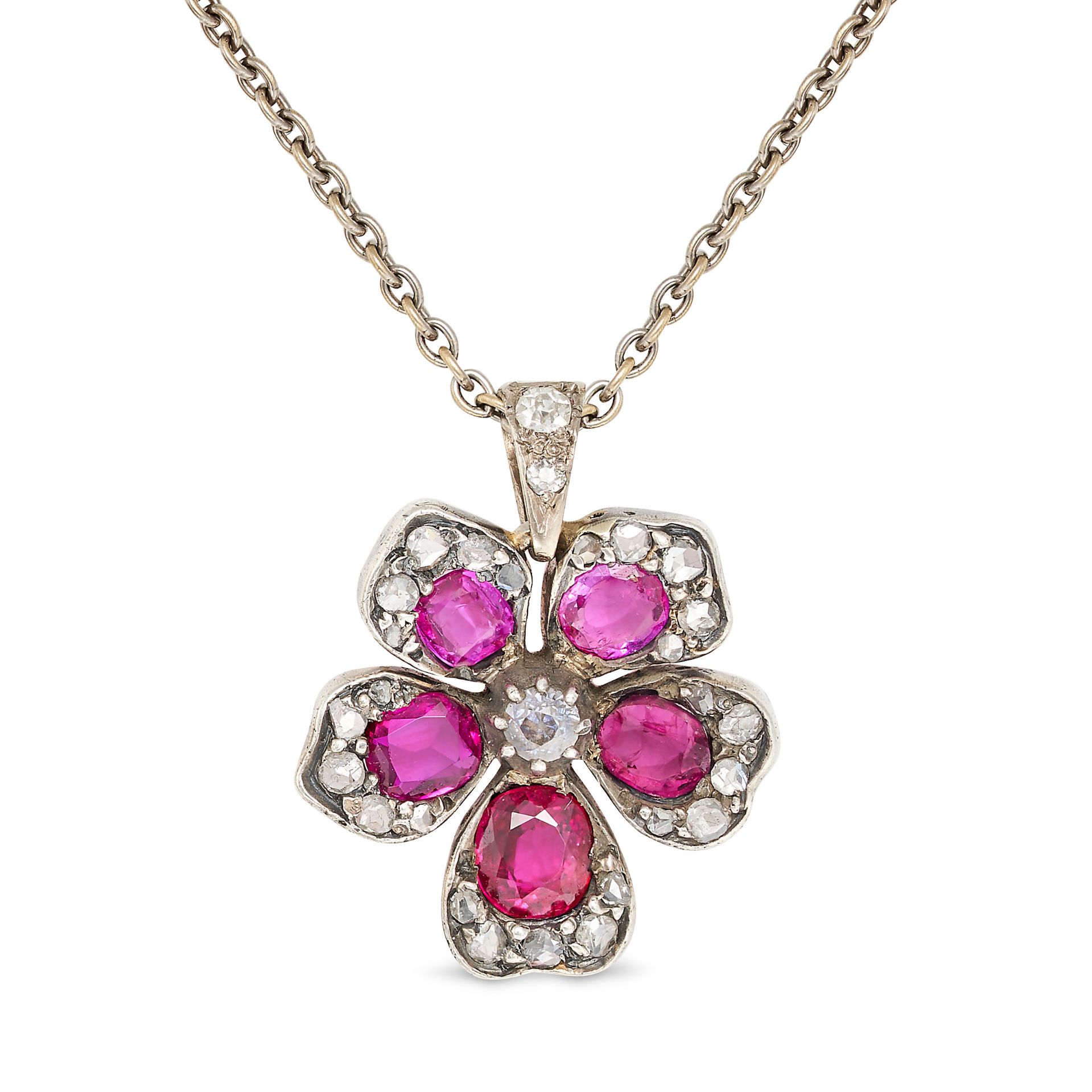 AN ANTIQUE RUBY AND DIAMOND FLOWER PENDANT NECKLACE in gold and silver, the pendant designed as a...
