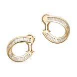 A PAIR OF DIAMOND HOOP EARRINGS in yellow gold, each designed as a stylised hoop set with baguett...