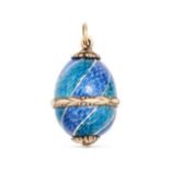 AN ANTIQUE RUSSIAN ENAMEL EGG PENDANT in 14ct yellow gold, the pendant designed as an egg decorat...