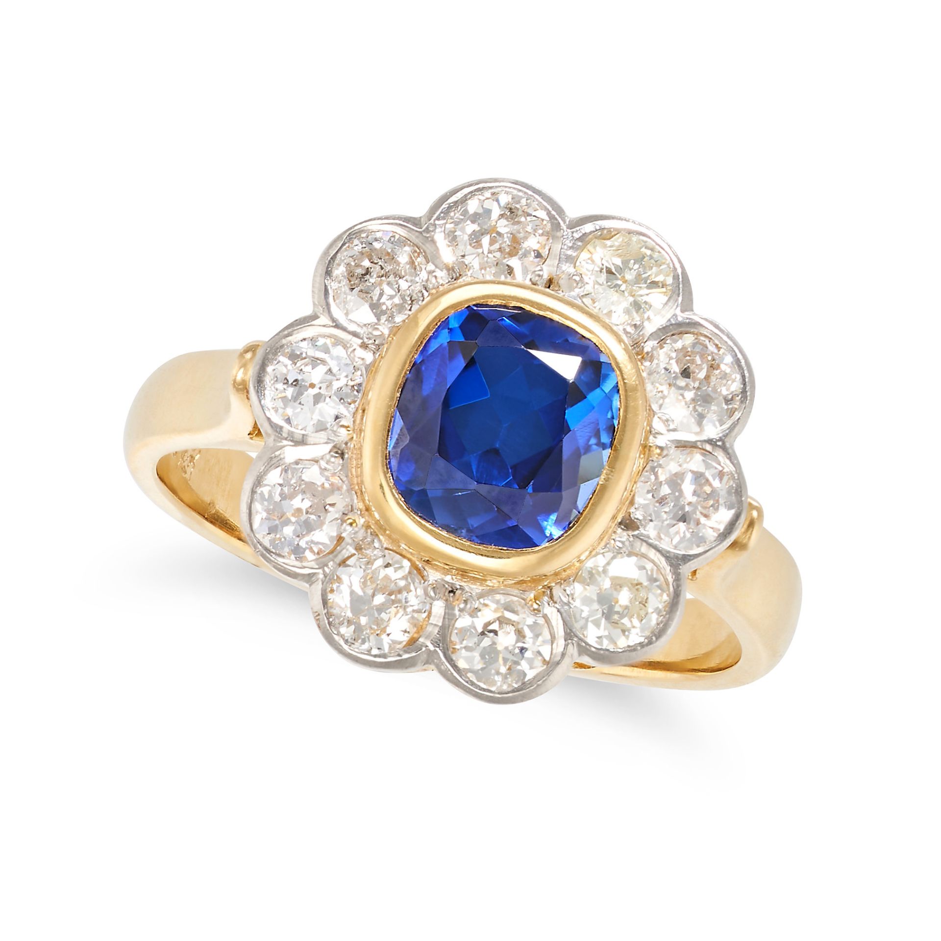 A SAPPHIRE AND DIAMOND CLUSTER RING in 18ct yellow gold and platinum, set with a cushion cut sapp...