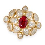 A RUBY AND DIAMOND CLUSTER RING in 18ct yellow gold, set with an oval cut ruby of approximately 1...