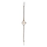 CYMA, A LADIES CYMAFLEX COCKTAIL WATCH in 9ct white gold, the dial with baton markers and Arabic ...