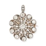 AN ANTIQUE DIAMOND BROOCH / PENDANT in yellow gold and silver, the scrolling body set throughout ...