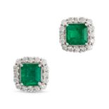 A PAIR OF EMERALD AND DIAMOND CLUSTER EARRINGS in 18ct white gold, each set with an octagonal ste...