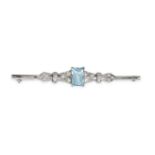 AN ART DECO AQUAMARINE AND DIAMOND BAR BROOCH in platinum, set with a rectangular step cut aquama...