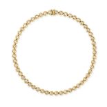 A DIAMOND RIVIERE NECKLACE in 18ct yellow gold, comprising a row of bezel set round brilliant cut...