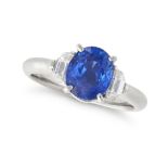 A CEYLON NO HEAT SAPPHIRE AND DIAMOND THREE STONE RING in platinum, set with an oval cut sapphire...