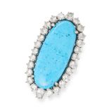 A TURQUOISE AND DIAMOND CLUSTER RING in white gold, set with an elongated oval cabochon turquoise...