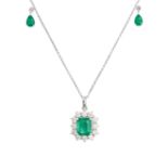 AN EMERALD AND DIAMOND PENDANT NECKLACE in 18ct white gold, the trace chain suspending an octagon...