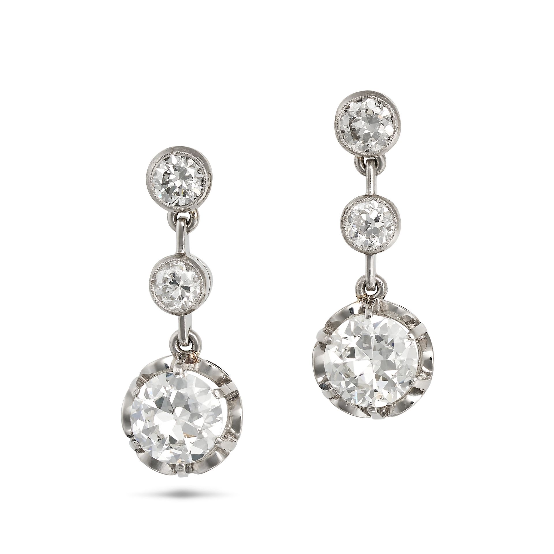 A PAIR OF ANTIQUE ART DECO DIAMOND DROP EARRINGS in platinum and 18ct yellow gold, each set with ...