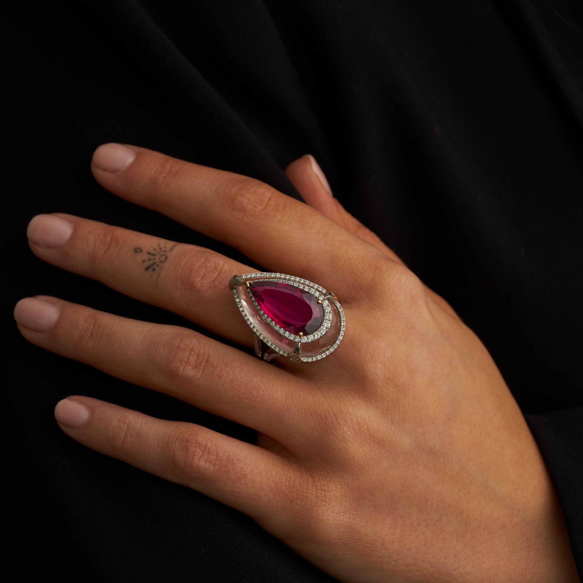 A RUBELLITE TOURMALINE, ROCK CRYSTAL AND DIAMOND DRESS RING in 18ct white gold, comprising a face...