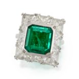 A FINE EMERALD AND DIAMOND RING in platinum, set with an octagonal step cut emerald of 2.89 carat...