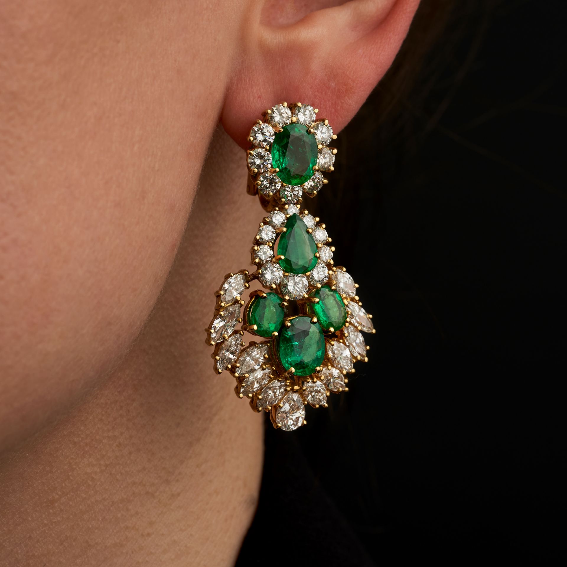 A PAIR OF EMERALD AND DIAMOND DROP EARRINGS in 18ct yellow gold, set with an oval cut emerald in ...