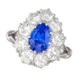 A FINE CEYLON NO HEAT SAPPHIRE AND DIAMOND CLUSTER RING in 18ct white gold and platinum, set with...