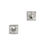 A PAIR OF DIAMOND STUD EARRINGS in platinum, each set with a Peruzzi cut diamond of approximately...